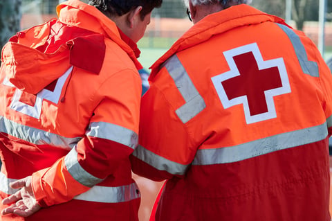 Emergency personnel in high-visibility jackets